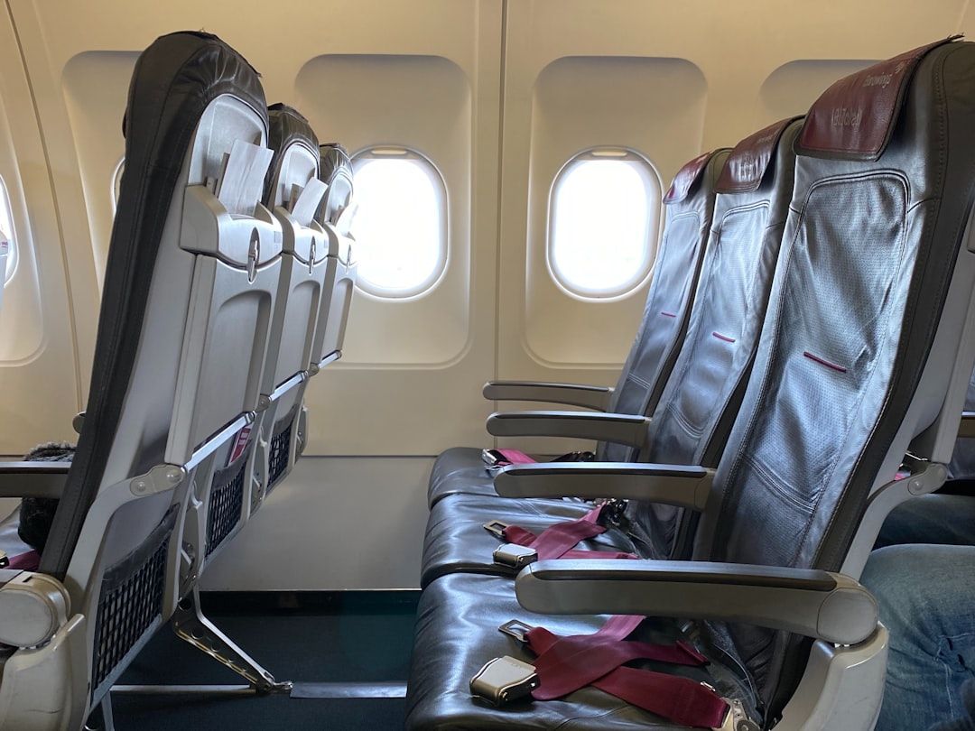 A close-up view of business class seats on a commercial airplane